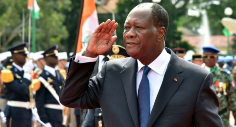 Ivory Coast President Alassane Ouattara gestures during celebrations marking the 55th anniversary of independence from France, in front of the presidential palace in Abidjan, on August 7, 2015.  By Issouf Sanogo AFPFile