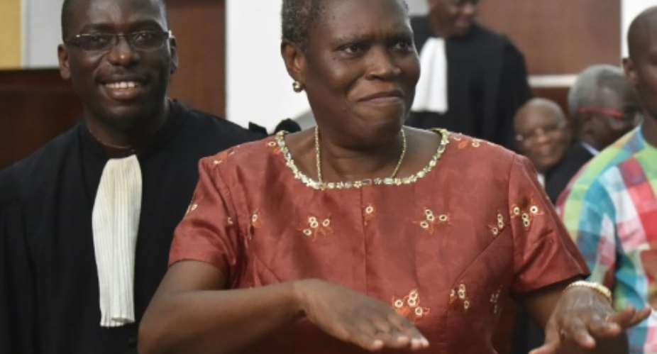 Ivory Coast's former first lady Simone Gbagbo arrives for the opening hearing of her trial on charges of crimes against humanity for her alleged role in the nation's 2010 electoral violence.  By Issouf Sanogo AFP