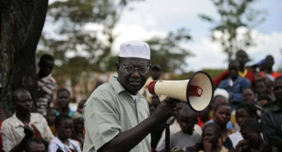 Malik Obama, a half-brother to US Democratic presidential hopeful Barak Obama, talks with the aid of a bulhorn November 2, 2008 to villagers at Kogelo.  By Tony Karumba AFPFile