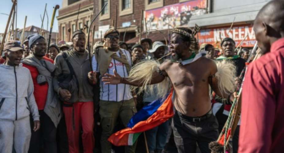 Imposing Zulu campaigner Phakela Ndabandaba has fronted many marches against undocumented migrants.  By EMMANUEL CROSET (AFP)