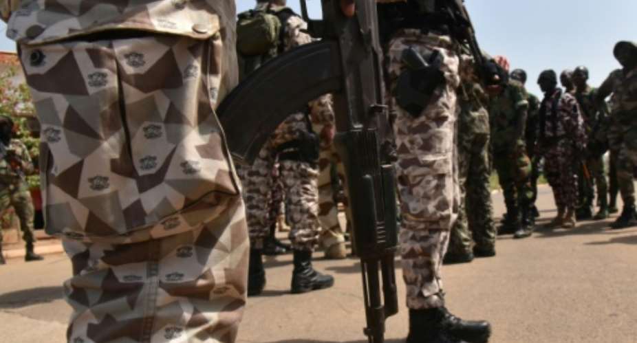 In a bid to quell the rising unrest, which left four soldiers dead, the Ivory Coast government pledged to improve the troops' livelihoods.  By Sia KAMBOU AFPFile