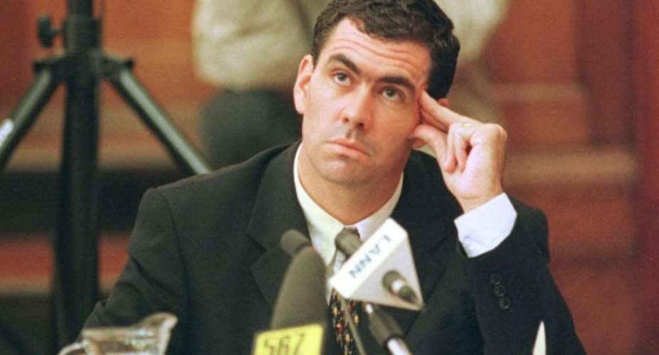 In a fix: Hansie Cronje ponders a point during his cross-examination at the King Commission of Inquiry into allegations of match-fixing in 2000.  By ANNA ZIEMINSKI AFPFile