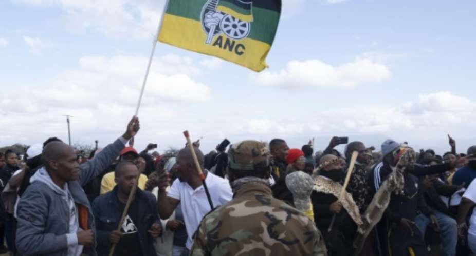 In a show of force, Jacob Zuma loyalists are camped outside their embattled leader's Nkandla homestead in Kwa-Zulu Natal province.  By Emmanuel Croset AFP