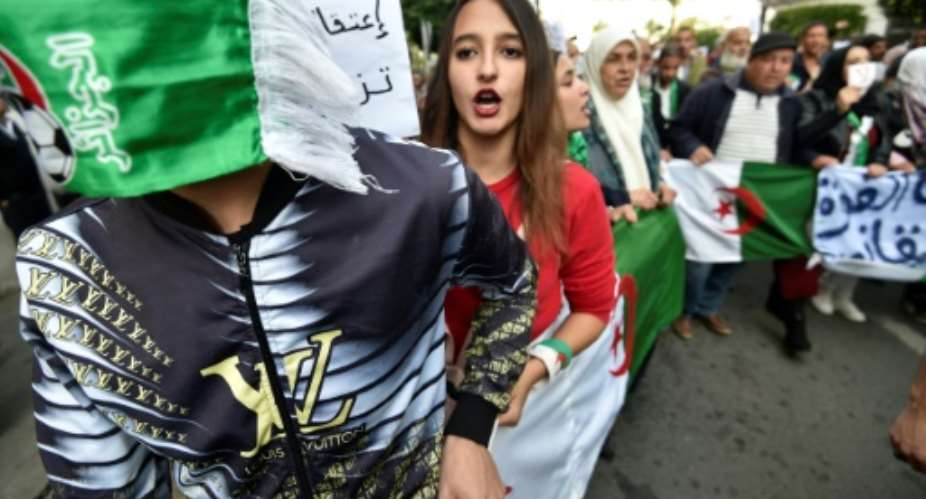 In Algeria, demonstrators are agitating for the cancellation of elections, saying they do not want former regime figures to cement power.  By RYAD KRAMDI AFPFile