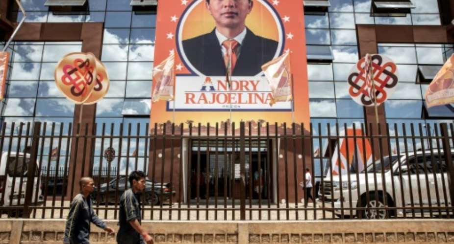 In Antananarivo, the glass headquarters of the Viva TV  FM group carries a huge portrait of its owner, Andry Rajoelina.  By GIANLUIGI GUERCIA AFP