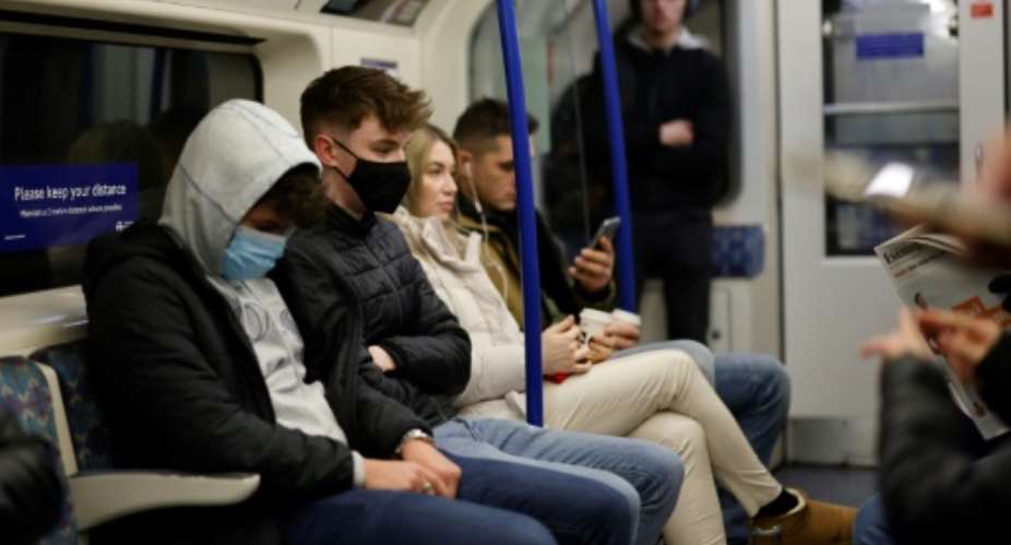 In Britain, new Covid rules includws mandatory mask-wearing in shops and on public transport.  By Tolga Akmen AFP