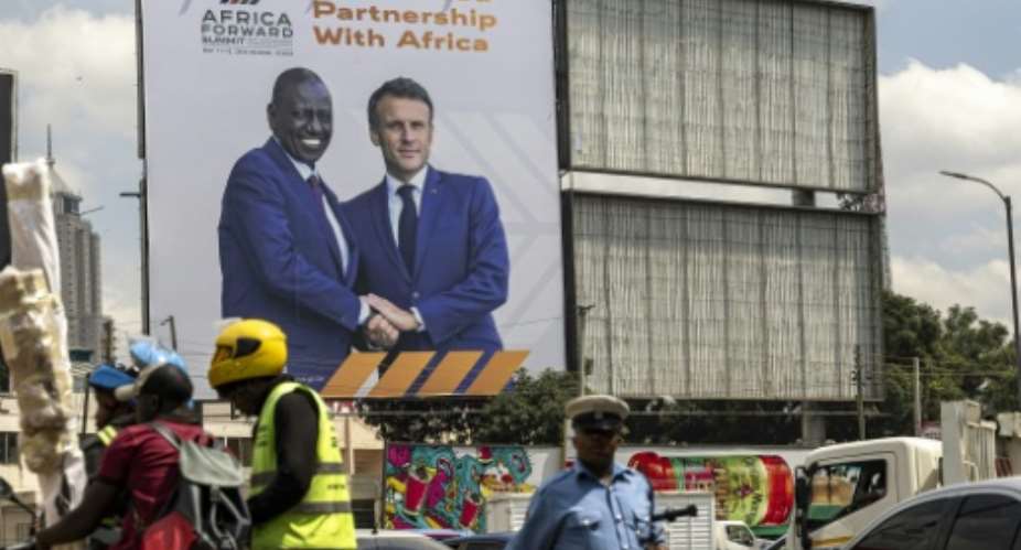 In Kenya, President Emmanuel Macron will co-host a summit bringing together African leaders and business executives.  By SIMON MAINA (AFP)