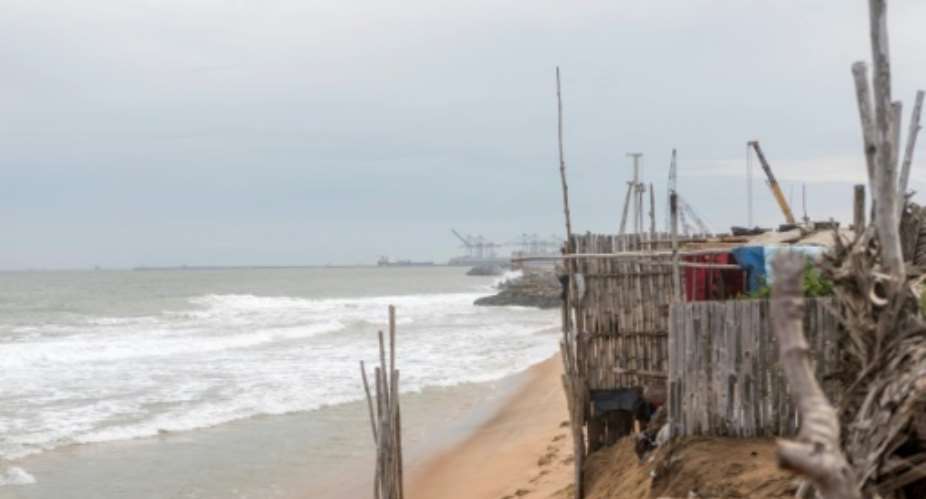 In the beachfront village of Agebkope on Togo's shore, houses have been swept into the sea and others teeter on the brink as coastal erosion worsens.  By YANICK FOLLY AFP