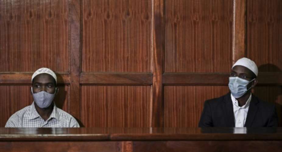 In the dock: Hassan Hussein Mustafa, left, and Mohamed Ahmed Abdi awaiting the verdict on Friday.  By TONY KARUMBA AFP