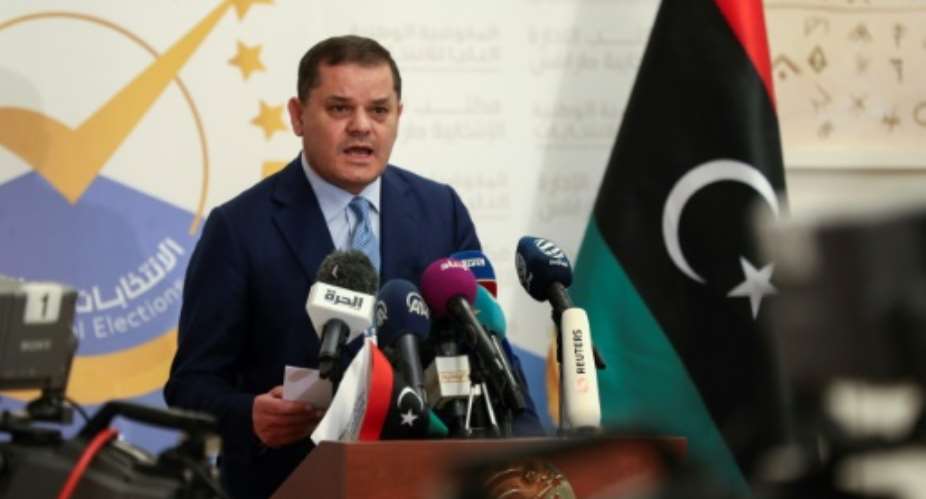 In this file photo, Libya's interim premier Abdulhamid Dbeibah speaks after registering his candidacy for next month's presidential election on November 21, 2021.  By Mahmud TURKIA AFPFile