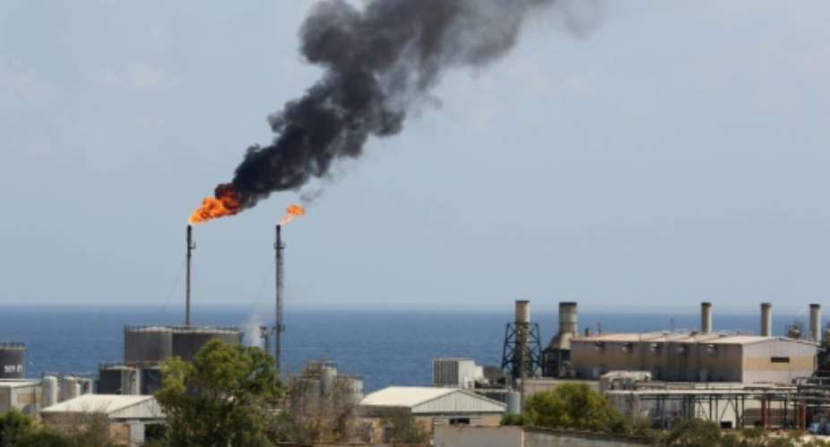 In this file photo taken on August 22, 2013, a general view shows the Libyan oil installation at Zawiya.  By Mahmud TURKIA AFPFile