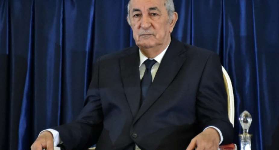 In this file photo taken on December 19, 2019, Abdelmadjid Tebboune is seen during his formal swearing-in ceremony as Algerian president. Tebboune was admitted to hospital in Germany on October 28 and has tested positive for coronavirus.  By RYAD KRAMDI AFPFile