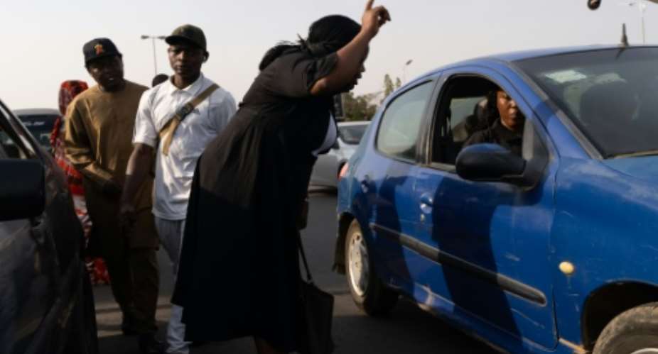 Increased fuel prices in Nigeria have driven up the cost of fares for commuters, as well as food and goods throughout the wider eocnomy.  By Light Oriye Tamunotonye (AFP)