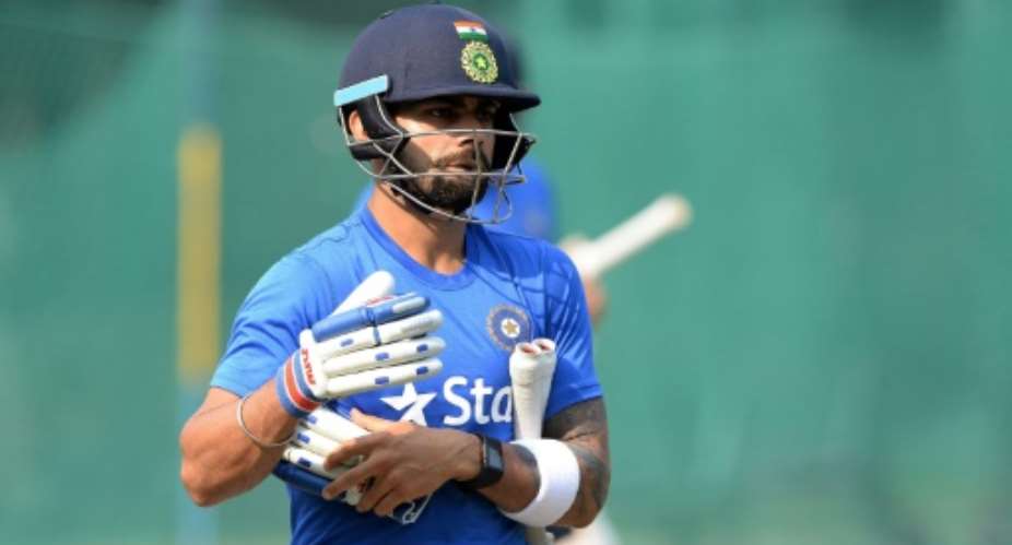 India's captain Virat Kohli prepares to bat in the nets during a training session in Mohali on November 4, 2015, on the eve of their first Test match against South Africa.  By Prakash Singh AFP
