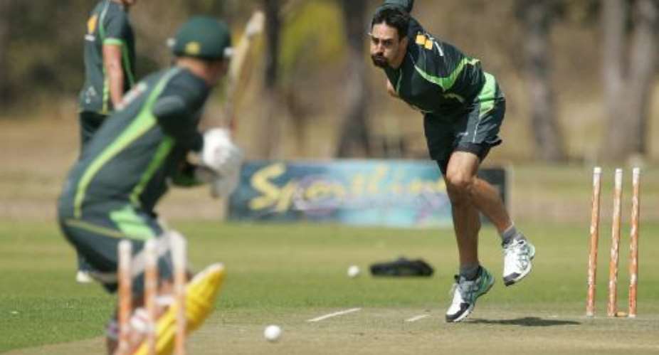Australia's Mitchell Johnson during a training session ahead of the tri-series between Australia, South Africa and hosts Zimbabwe in Harare on August 23, 2014.  By Jekesai Njikizana AFP