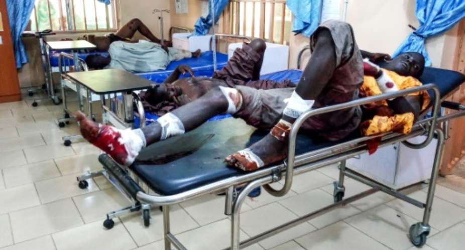 Injured men in hospital after a suicide bomber attack in northeastern Nigeria last month, with another 31 killed late Saturday in a similar attack suspected to be the work of Boko Haram jihadists..  By AUDU MARTE AFP