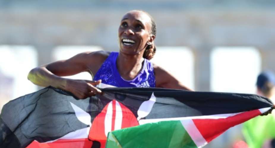 Kenya's Gladys Cherono celebrates winning the Berlin Marathon women's race in September 2015.  By John Macdougall AFP