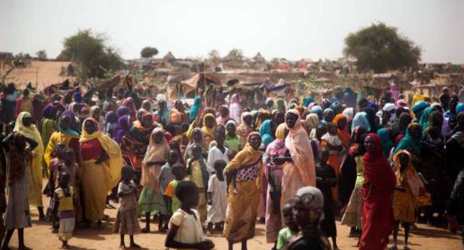A handout picture released by the United Nations-African Union Mission in Darfur UNAMID shows displaced women and children in the Zam Zam camp in North Darfur, on April 3, 2014.  By Albert Gonzalez Farran UNAMIDAFPFile