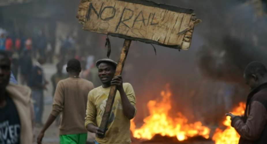 International observer missions called for calm and restraint in Kenya after isolated protests broke out following opposition leader Raila Odinga's rejection of early election results.  By TONY KARUMBA AFP