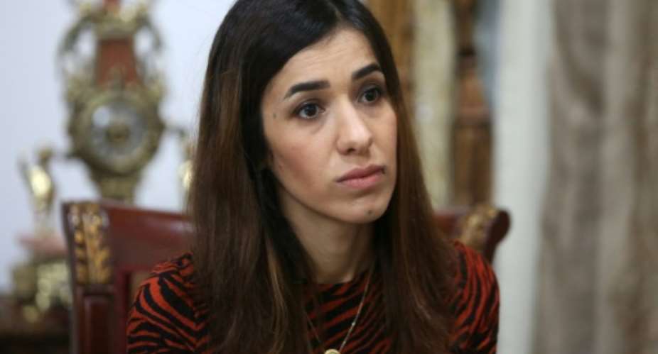 Iraqi Nobel laureate Nadia Murad pictured December 2018 was the victim of human trafficking for sexual exploitation, but trafficking is also used to finance activities or increase workforces.  By SABAH ARAR AFPFile