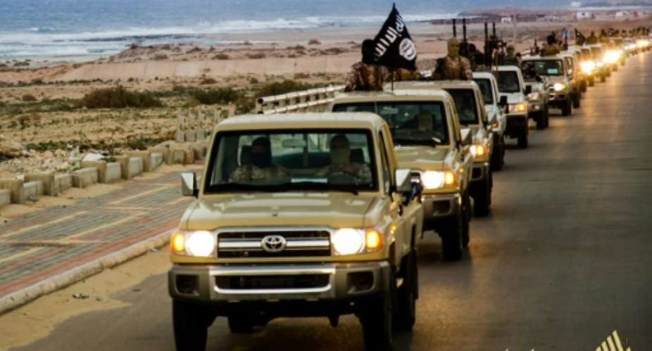 An image from Islamist media outlet Welayat Tarablos on February 18, 2015 allegedly shows members of the Islamic State group parading in a street in Libya's coastal city of Sirte.  By  Welayat TarablosAFPFile