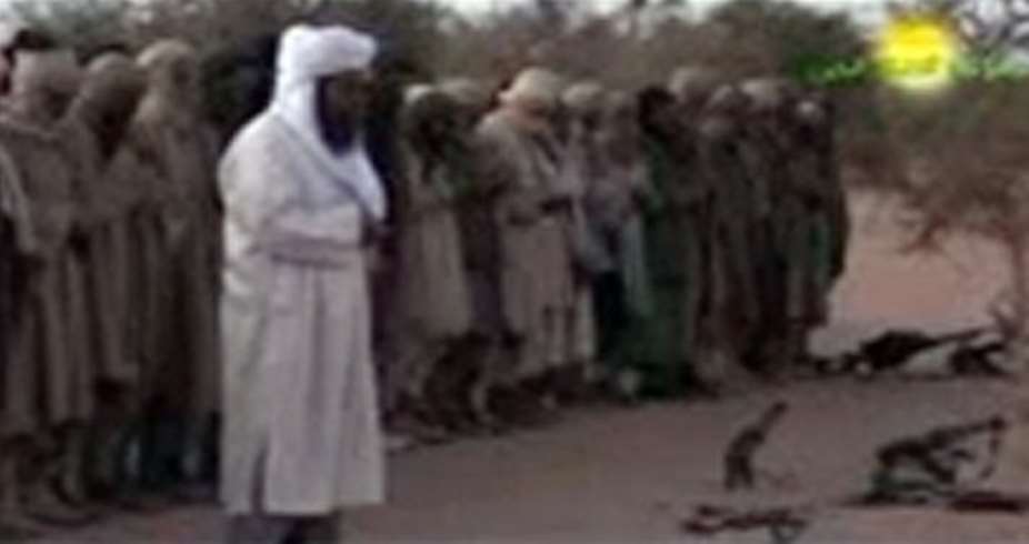 This handout photograph released by Ansar Dine on March 11, 2012 reportedly shows the groups leader Iyad Ag Ghaly (C).  By  (AFP/ANSAR DINE/File)