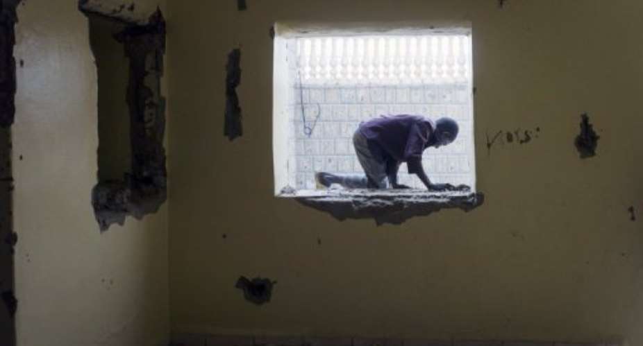 A child plays on January 13, 2013 in a Timbuktu house formerly owned by Ansar Dine spokesman Senda Ould Boumama.  By Fred Dufour (AFP/File)