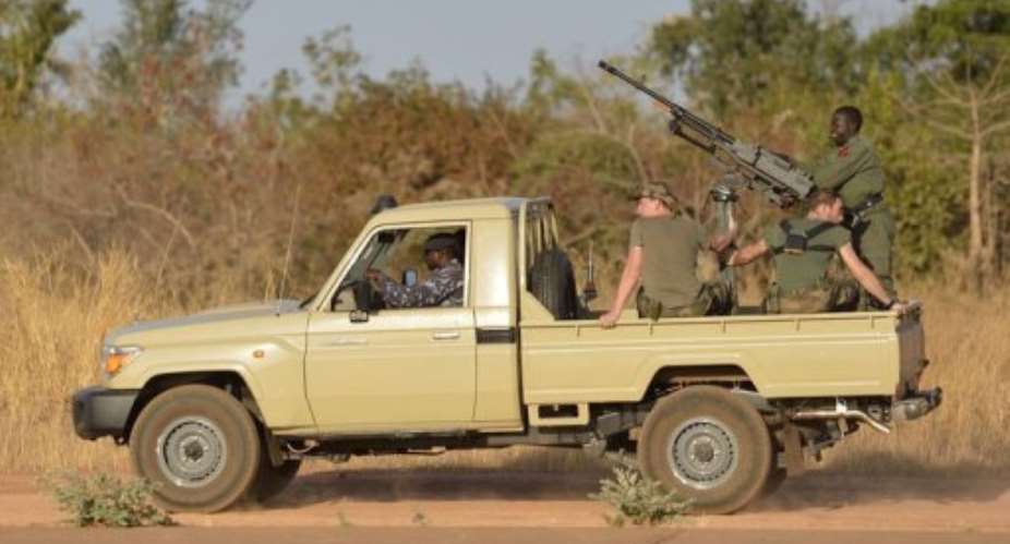 French soldiers patrol in a Malian military vehicle at the 101 military airbase near Bamako on January 14, 2013.  By Eric Feferberg (AFP)