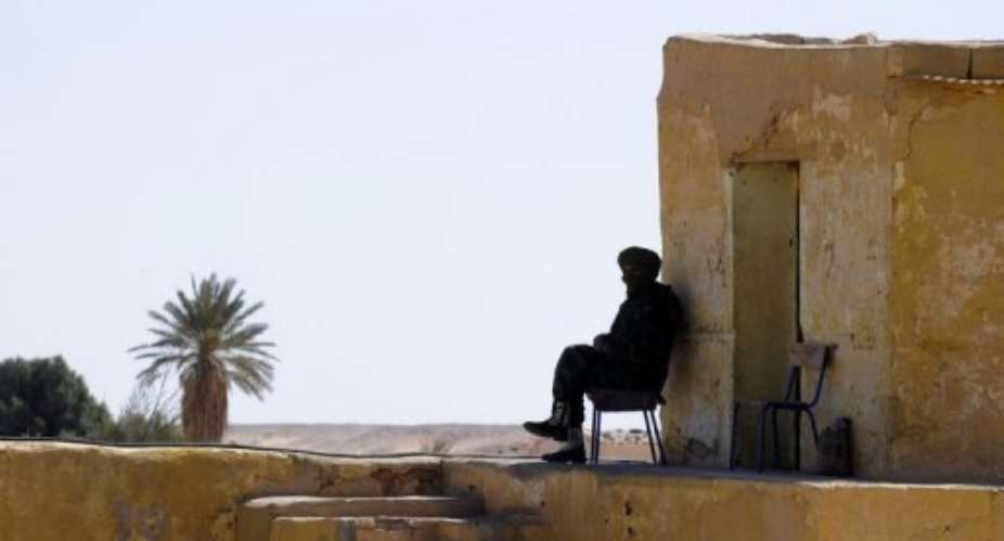 Polisario Front soldiers guard the Presidential palace in 2011 by the Rabuni refugee camp.  By Dominique Faget AFPFile
