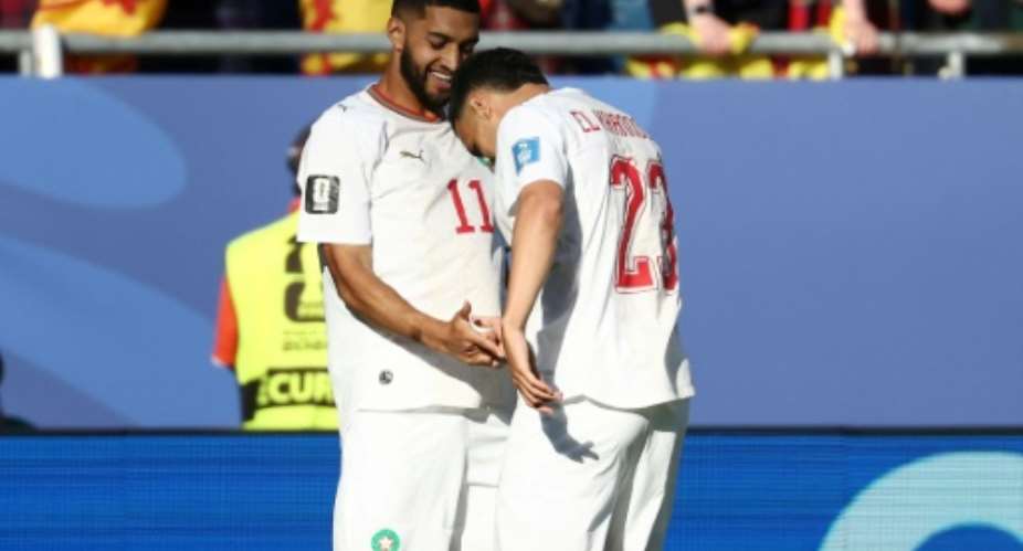 Ismael Saibari (L) celebrates with teammate Bilal El Khannouss after scoring for Morocco against Scotland at the World Cup on Friday.  By FRANCK FIFE (AFP)