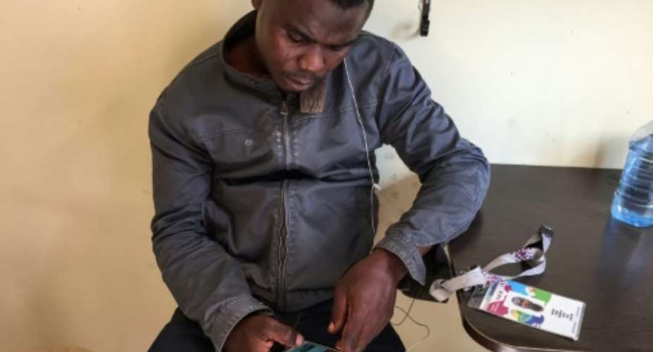 Ismail Olamilekan, 21, and his brother Sodiq, 25, said they paid 250,000 naira 600 euros, 700 each to a man in Lagos for their Fan IDs.  By Roland LLOYD PARRY AFP