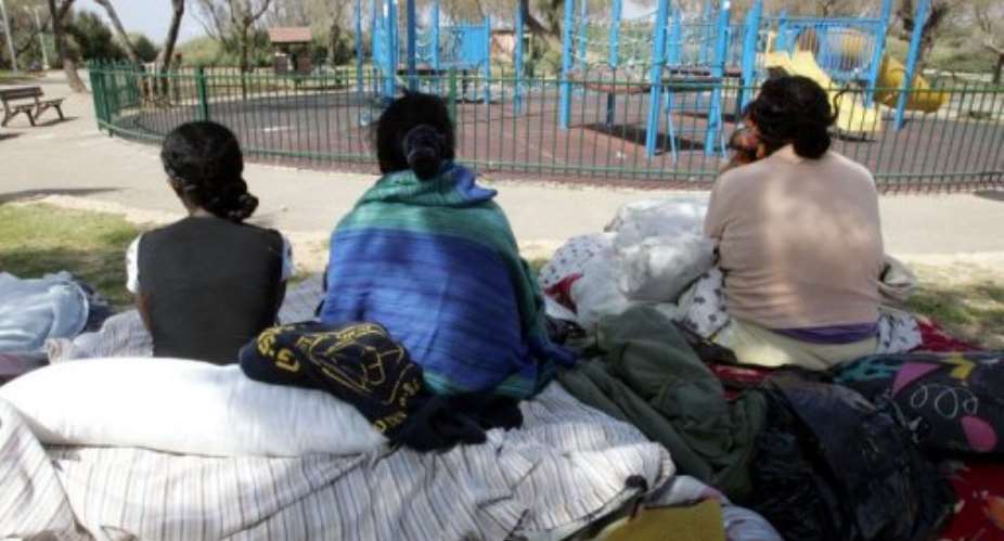 Illegal African immigrants from Ivory Coast and Eritrea gather at a public garden in Tel Aviv, on March 13, 2008.  By Jack Guez (AFP/File)