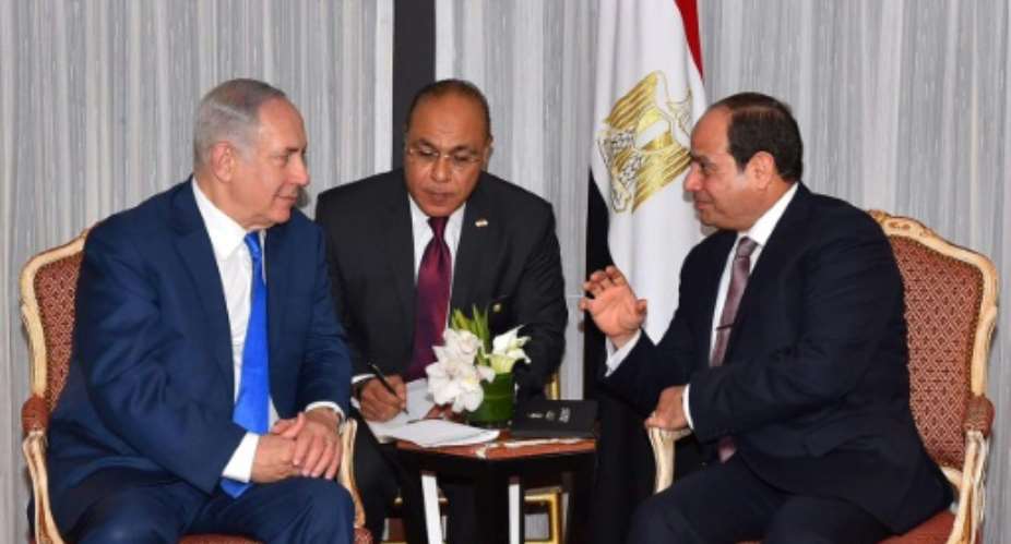 Israeli Prime Minister Benjamin Netanyahu L meets with Egyptian President Abdel Fattah al-Sisi in New York to discuss the Middle East peace process, in their first public talks, on September 18, 2017.  By Egyptian Presidency Egyptian PresidencyAFP