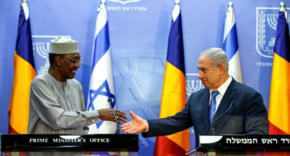 Israeli Prime Minister Benjamin Netanyahu R shakes hands with Chadian President Idriss Deby Itno at a joint statements in Jerusalem November 25, 2018.  By RONEN ZVULUN POOLAFPFile