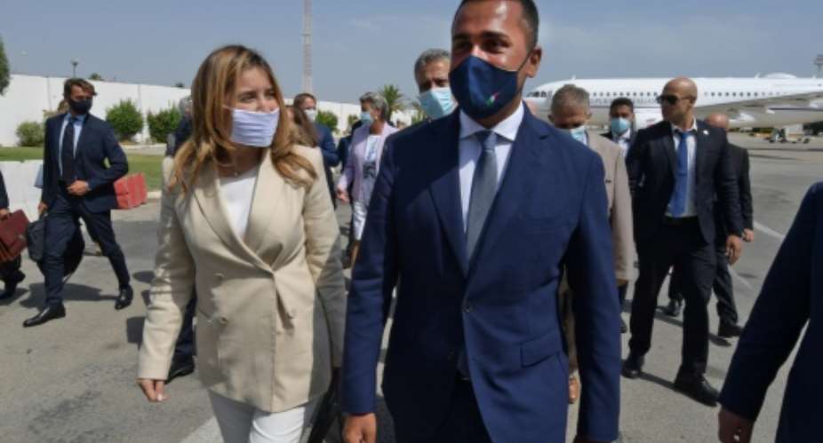 Italian Foreign Minister Luigi Di Maio R is welcomed on his arrival in Tunis by Tunisian Secretary of State for Foreign Affairs Salma Ennaiefer.  By Fethi Belaid AFP