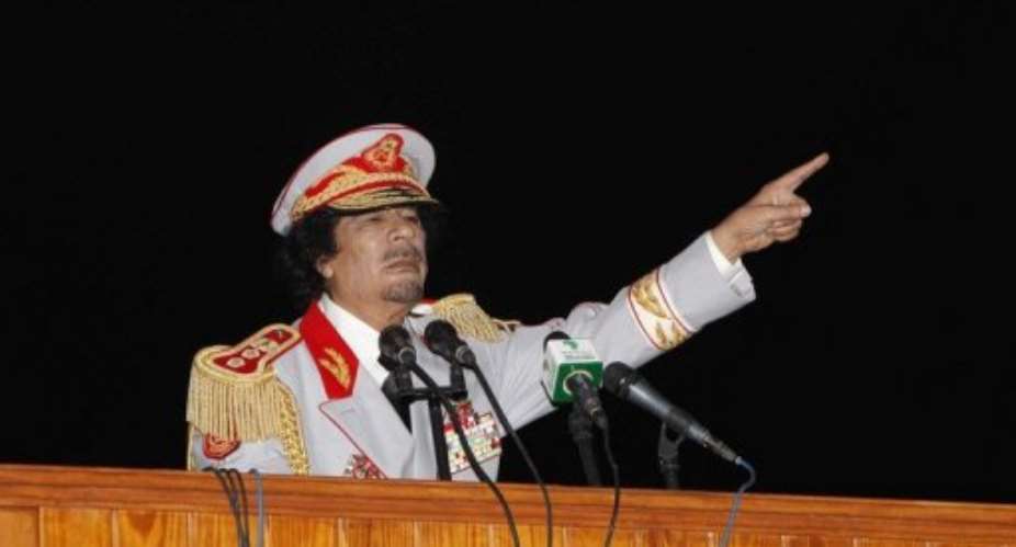 Libyan leader Moamer Kadhafi speaks in 2010.  By Mahmud Turkia AFPFile