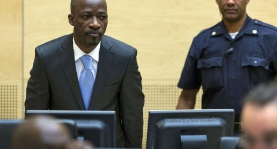 Former Ivorian youth militia leader Charles Ble Goude left enters the courtroom of the International Criminal Court ICC for his initial appearance in The Hague, on March 27, 2014.  By Michael Kooren POOLAFPFile