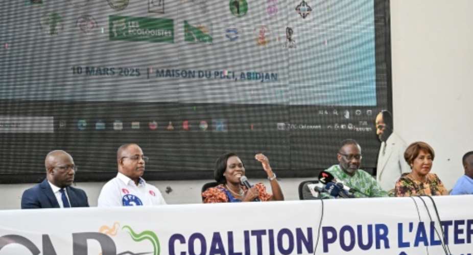 Ivorian opposition leader Tidjane Thiam (2nd R) and former first lady Simone Ehivet Gbagbo (3rd L) are members of the coalition created to demand electoral reform ahead of October presidential elections.  By Sia KAMBOU (AFP)