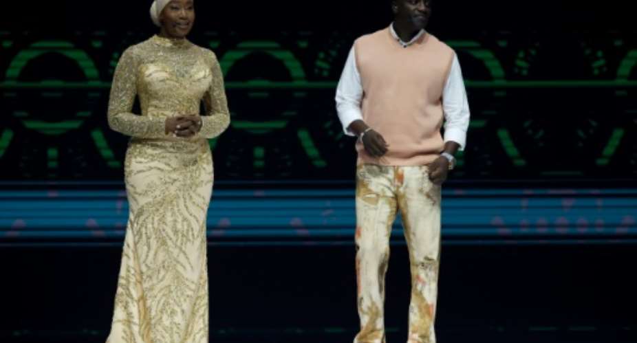 Ivorian singer and TV host Konnie Toure L and Senegalese-American singer Akon during the 2024 Africa Cup of Nations draw in Abidjan.  By WIKUS DE WET AFP