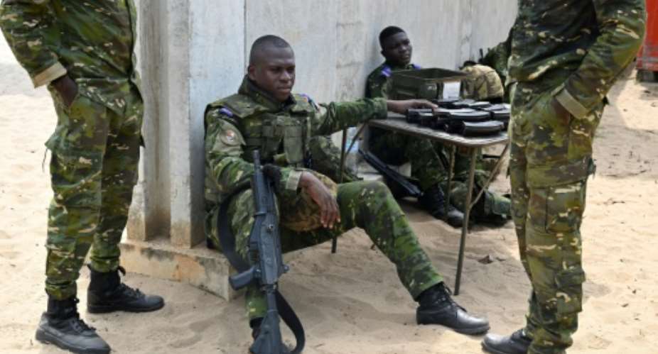 Ivorian soldiers  resting at a shooting range in Port-Bouet.  By Issouf SANOGO (AFP)