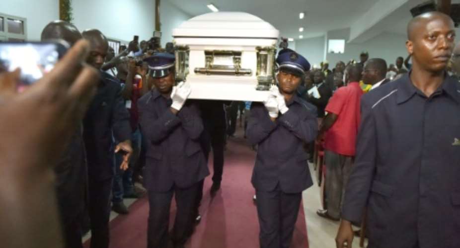 The coffin of Congolese rumba star Papa Wemba is carried during a memorial ceremony in Abidjan, on April 27, 2016.  By Issouf Sanogo AFP