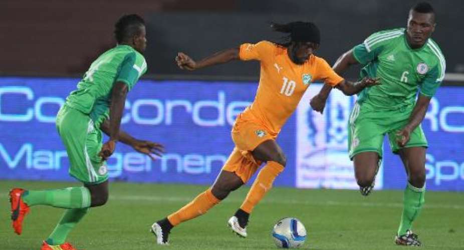 Ivory Coast's Gervinho C vies for the ball against Nigeria's Negwuekwe Azubuike R during an international friendly football match in preparation for the Africa Cup of Nations on January 11, 2015 in Abu Dhabi.  By  AFP