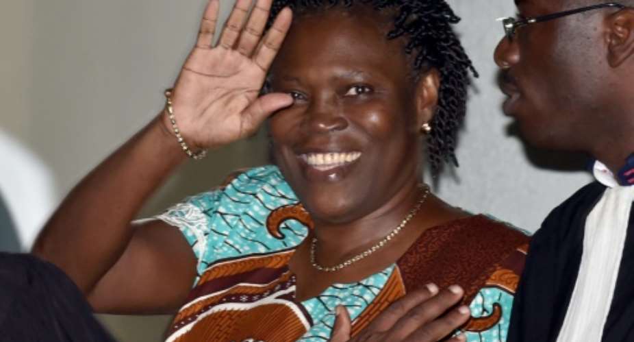Former first lady Simone Gbagbo waves as she arrives at the Court of Justice in Abidjan, Ivory Coast on February 23, 2015.  By Issouf Sanogo AFPFile