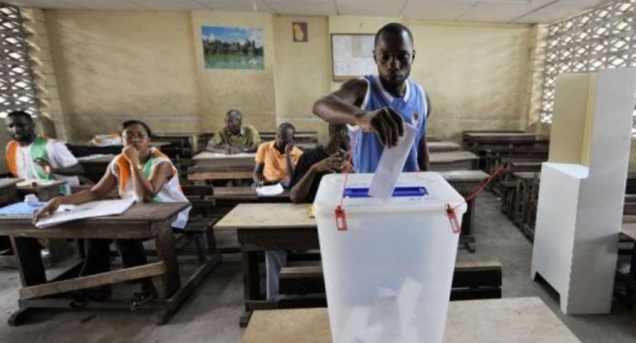 Ouattara's coalition is widely expected to gain a majority in the assembly.  By Sia Kambou AFP