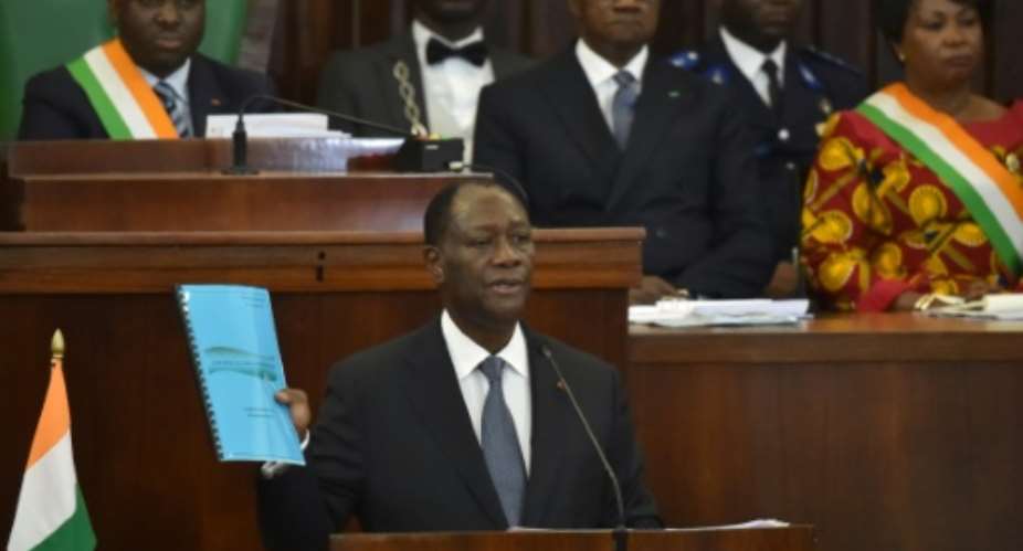 Ivory Coast President Alassane Ouattara presents to the parliament the draft of a new constitution, on October 5, 2016 in Abidjan.  By Issouf Sanogo AFPFile