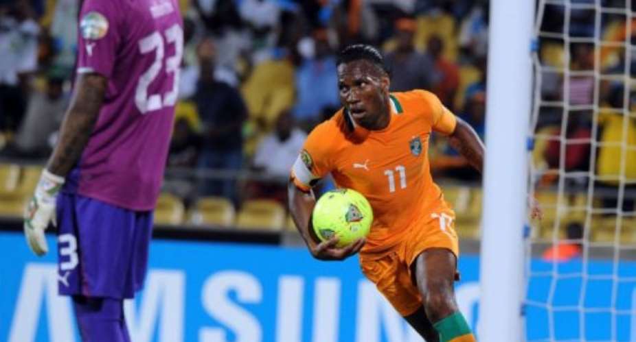 Ivory Coast forward Didier Drogba celebrates after scoring in Rustenburg on January  30, 2013.  By Alexander Joe AFP