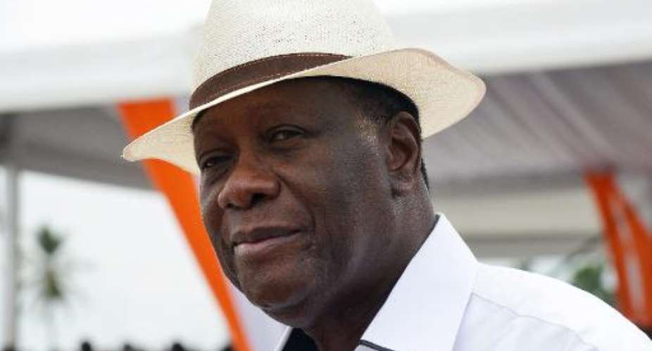 Ivory Coast President Alassane Ouattara, pictured here in Anyama on April 11, 2015, announced that civil servants' salaries can finally increase after more than two decades.  By Issouf Sanogo AFPFile