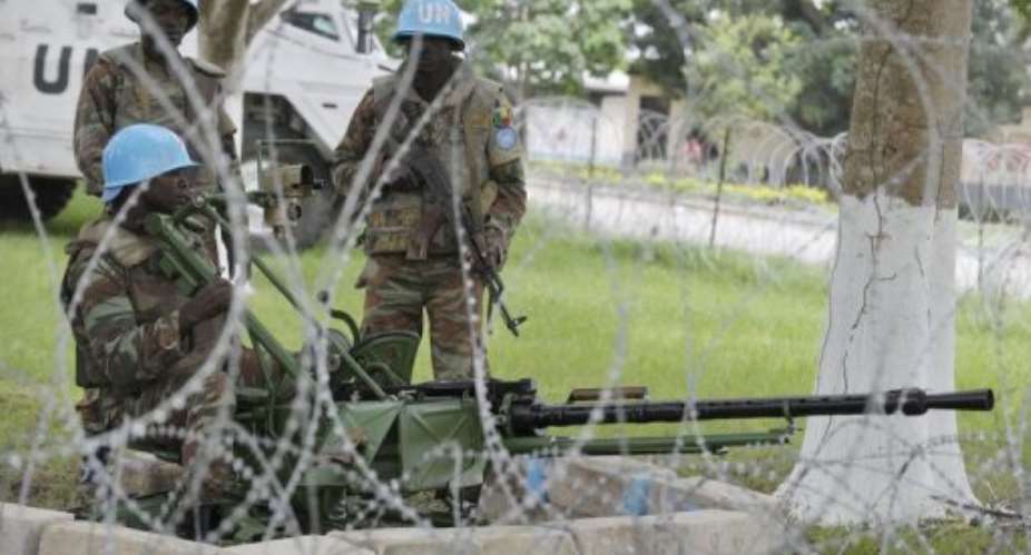 United Nations peacekeepers hold their position inside of the Akouedo military camp in Abidjan on August 6, 2012.  By Issouf Sanogo (AFP/File)