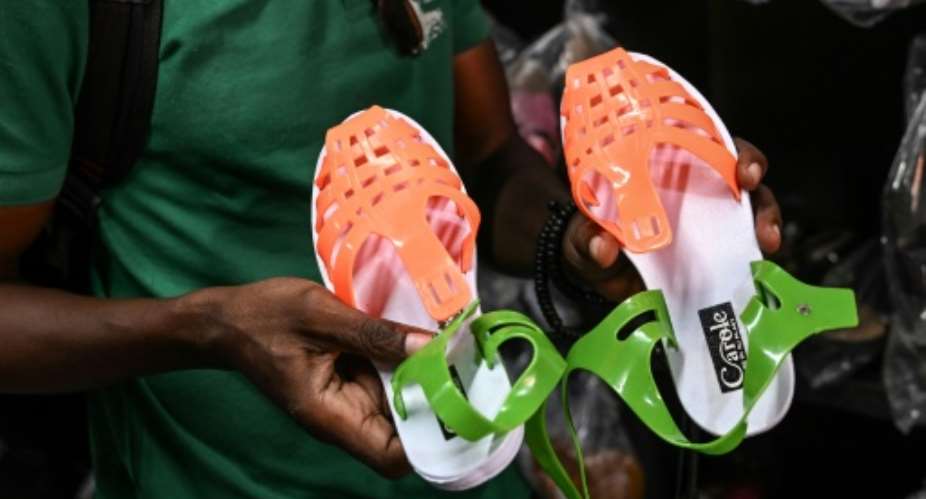 Ivory Coast's 'leke' sandals are often in the country's national colours.  By Sia KAMBOU AFP