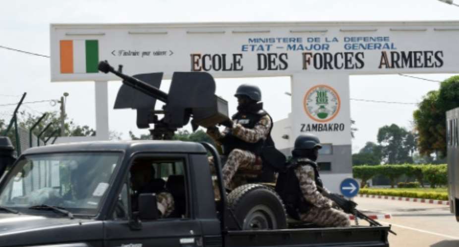 Ivory Coast's main port of Abidjan, one of Africa's biggest, was shut down when angry security forces began firing into the air amid protests by mutinous troops.  By Sia Kambou AFP